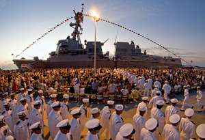 Crew members of the newest U.S. Navy destroyer, the 509-foot, $1.2 billion USS Spruance, man their ship during a sunset commissioning ceremony Saturday, Oct. 1, 2011, in Key West, Fla. Photos by Andy Newman/Florida Keys News Bureau